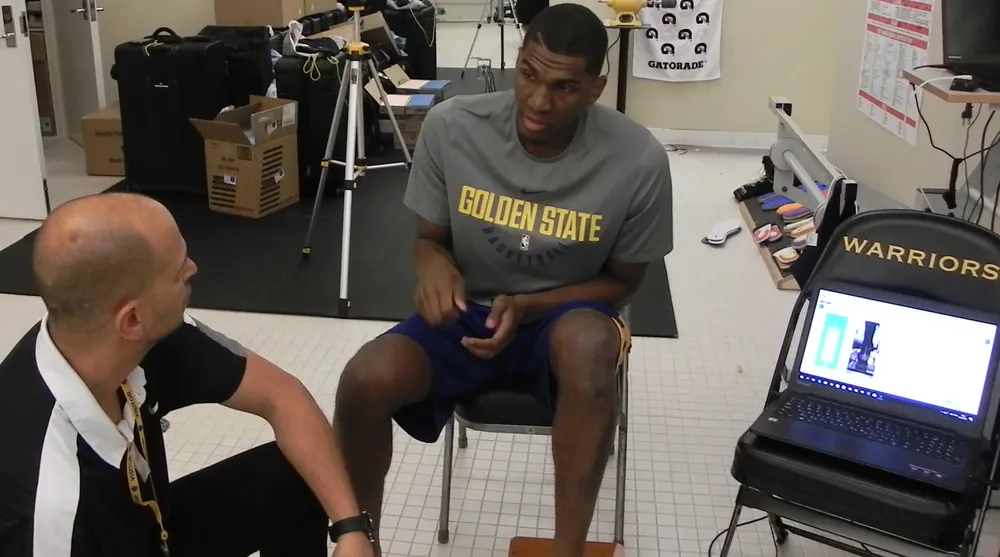 Kevon Looney with Tamir Kfir