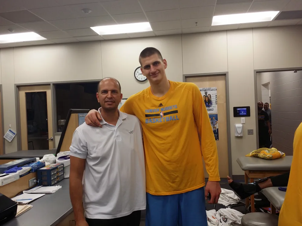 Nikola Jokić with Tamir Kfir in the Denver Nuggets locker room